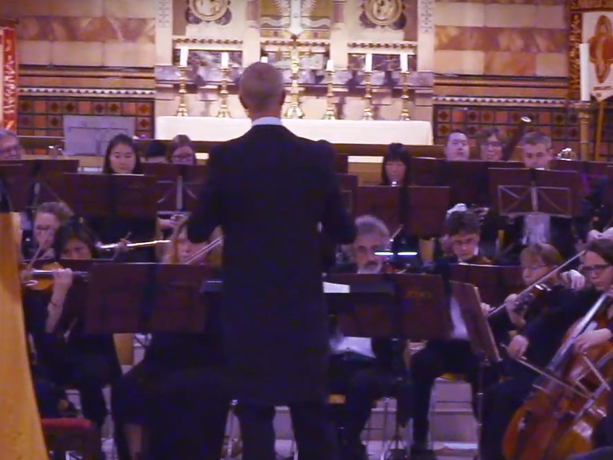 Kingston Philharmonia orchestra playing music in a church.
